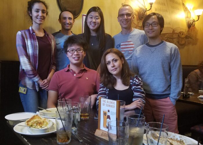 people posing at dinner